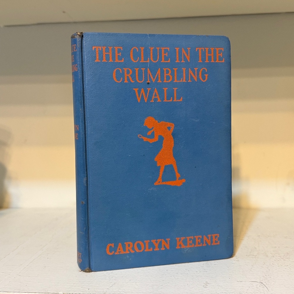 First Edition 1945 
The Clue In The Crumbling Wall 
Hardcover Book